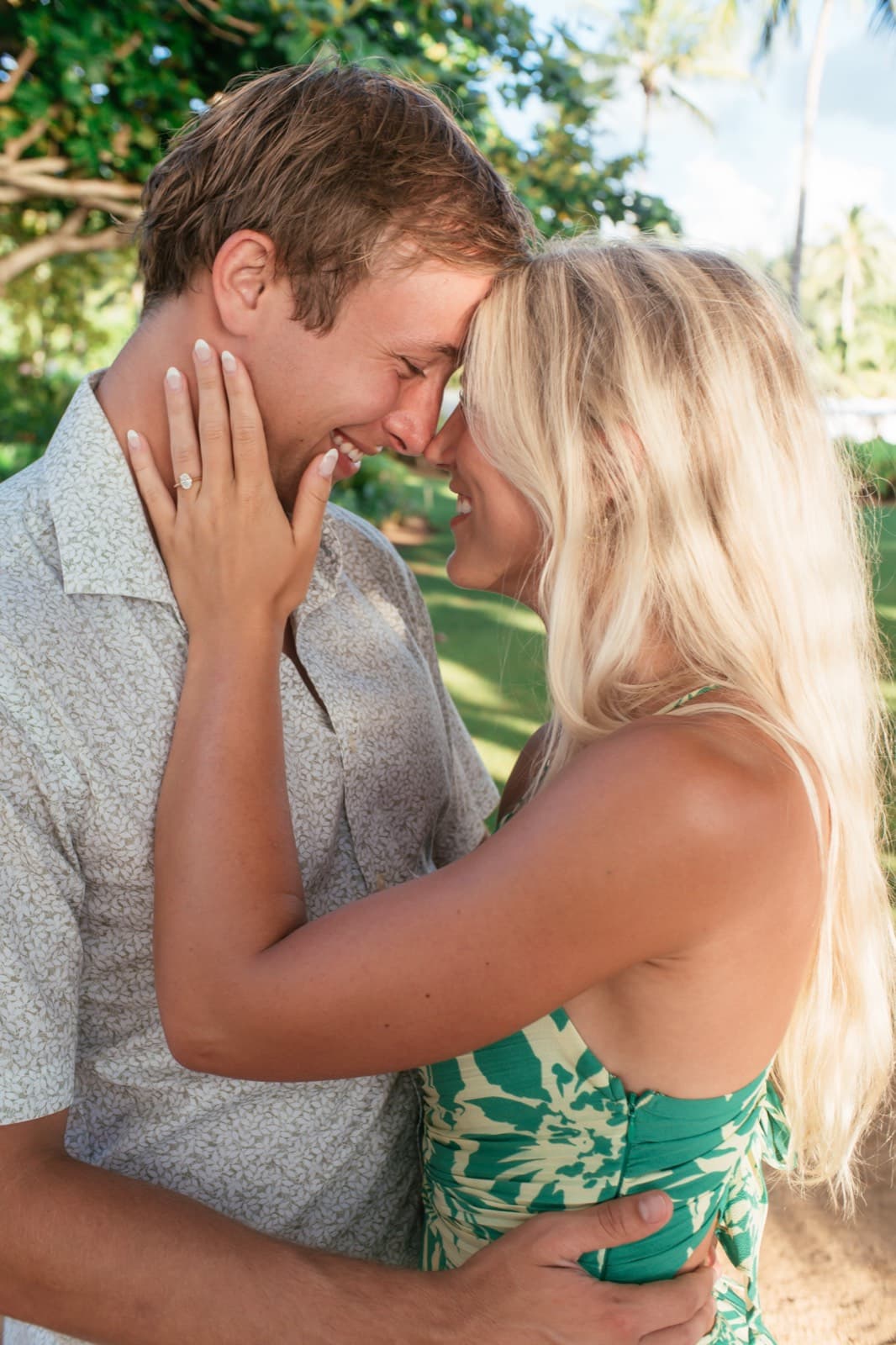 Will and Emma, foreheads together, laughing, her ring on his cheek
